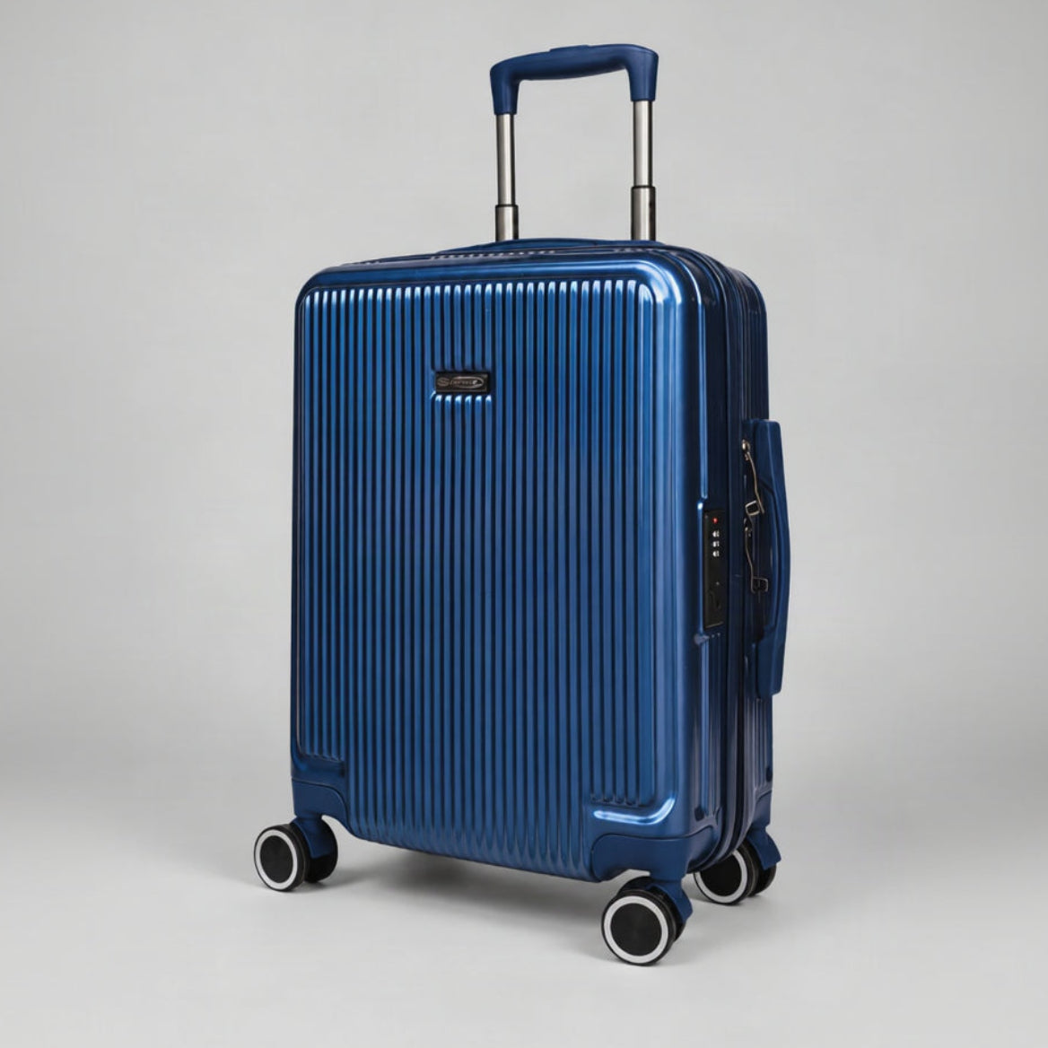 Trolley cabina Elegance blu navy visto a tre quarti, con manico telescopico e ruote girevoli