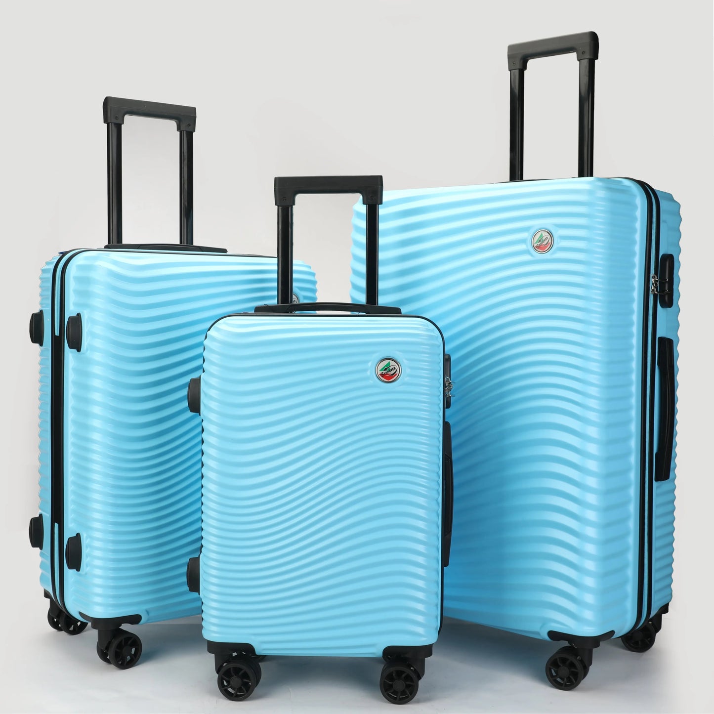 Set 3 trolley rigidi in ABS lucido visti frontalmente, eleganti e resistenti