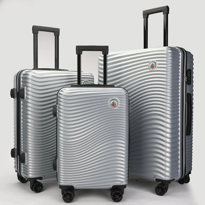 Set 3 trolley rigidi in ABS lucido visti frontalmente, eleganti e resistenti