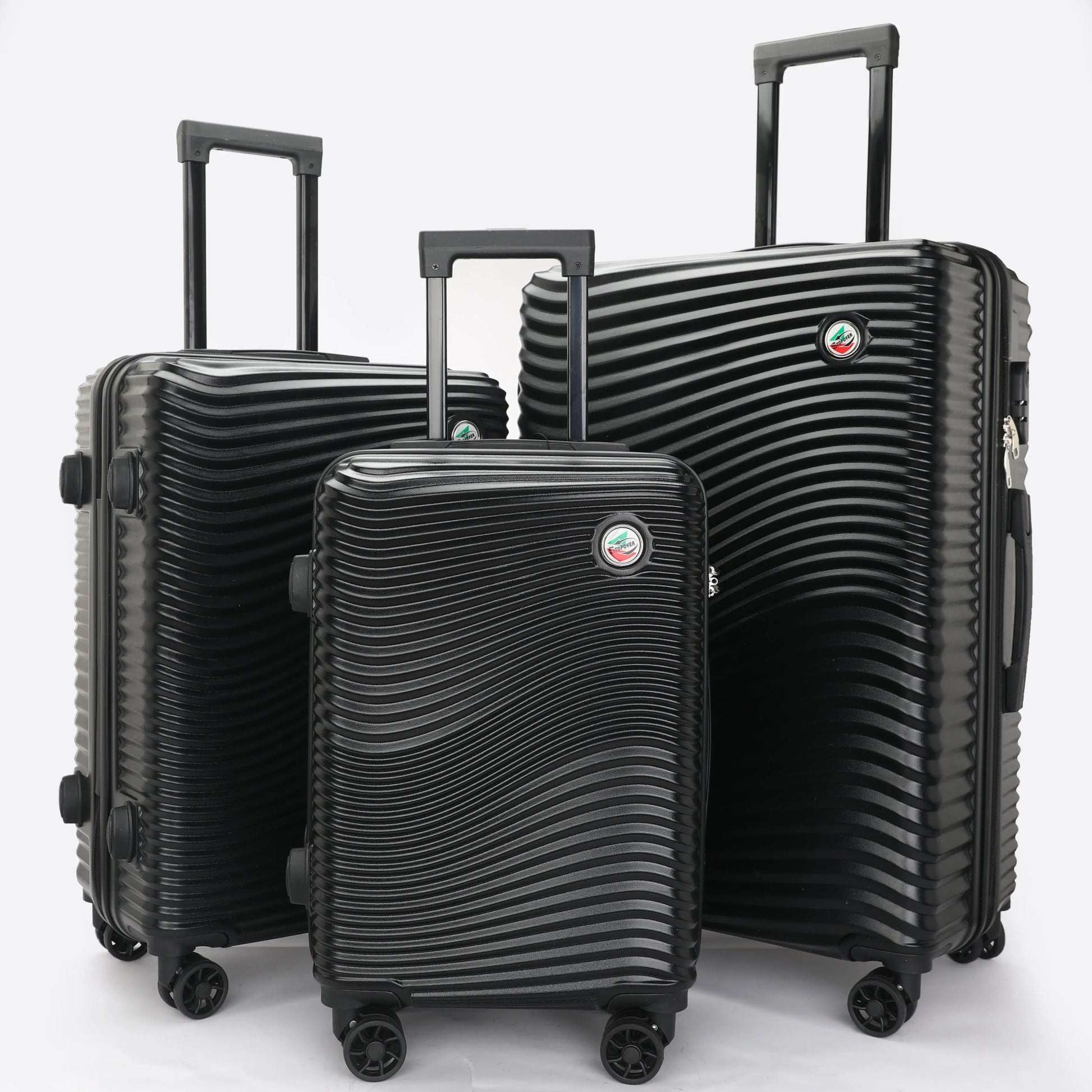 Set 3 trolley rigidi in ABS lucido visti frontalmente, eleganti e resistenti