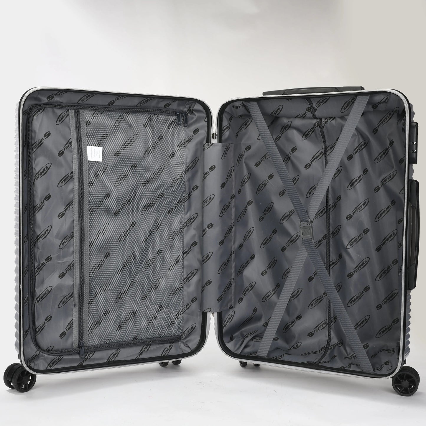 Interno dei trolley rigidi con elastico ferma biancheria e divisorio con zip