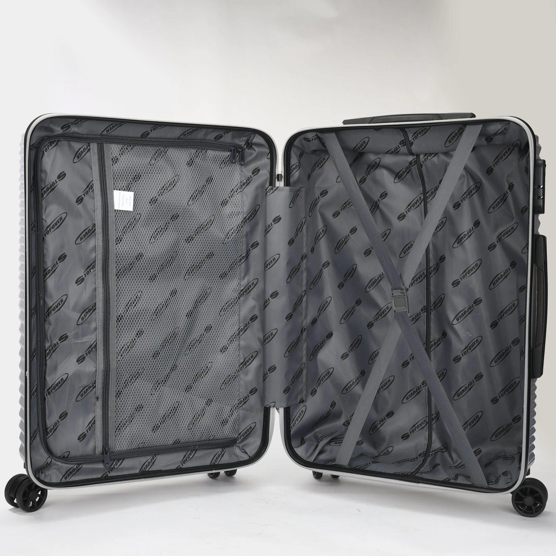 Interno dei trolley rigidi con elastico ferma biancheria e divisorio con zip