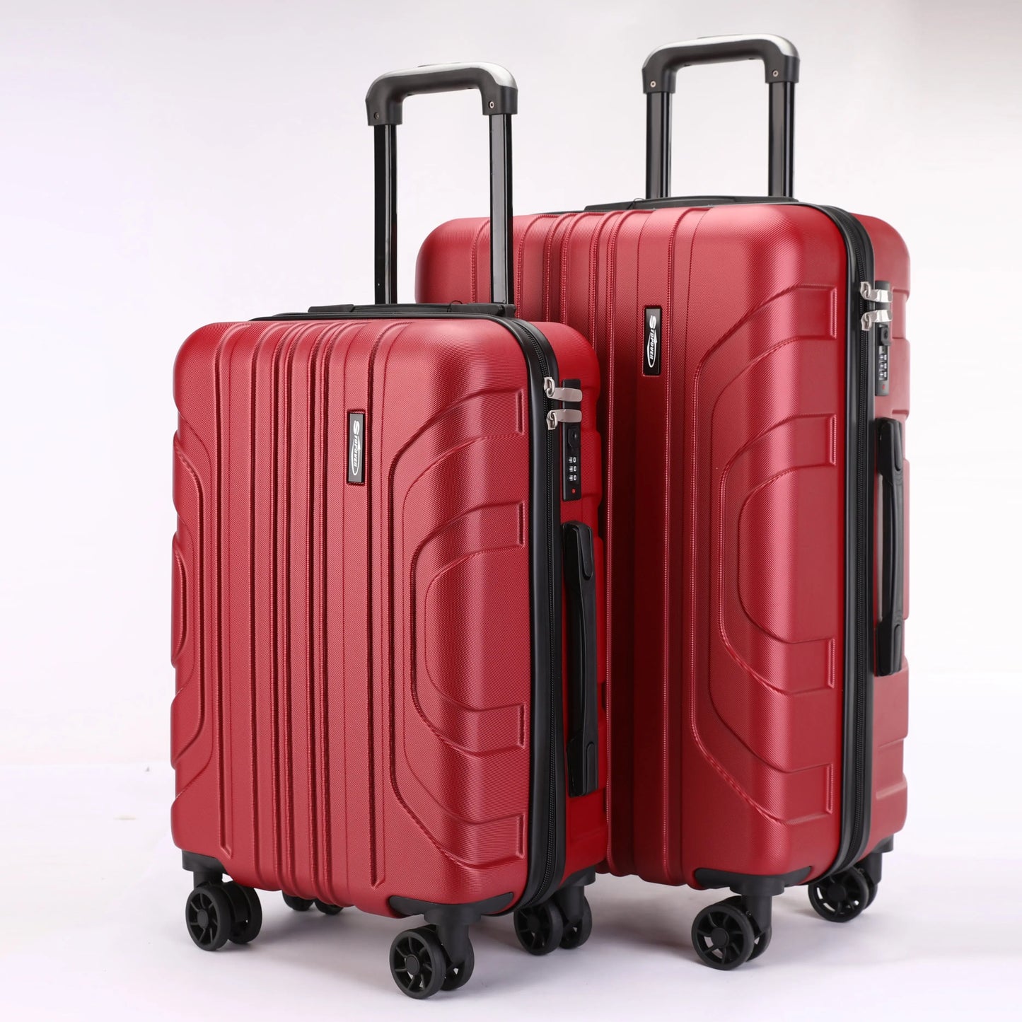 Vista frontale dei trolley rigidi ABS Stopover nelle due misure 65cm e 55cm con maniglie ergonomiche