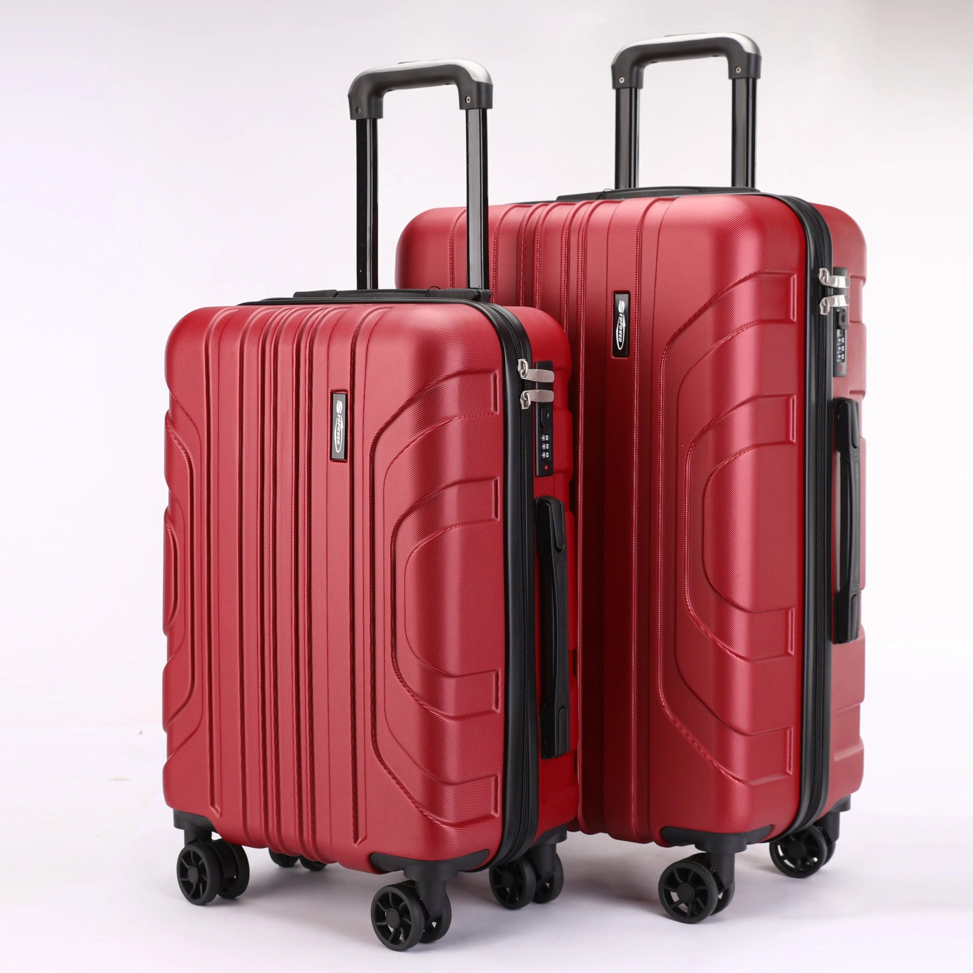Vista frontale dei trolley rigidi ABS Stopover nelle due misure 65cm e 55cm con maniglie ergonomiche