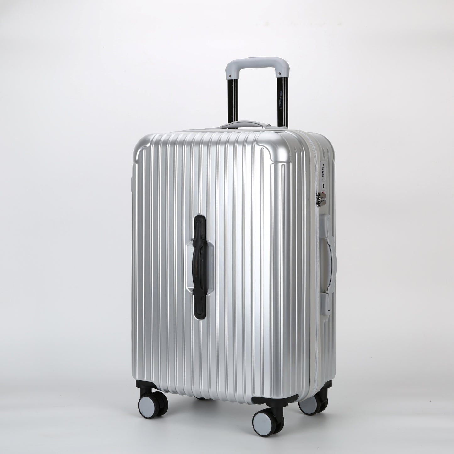 Trolley rigido argento STOPOVER con carrello telescopico interno in alluminio esteso e maniglia superiore ergonomica.